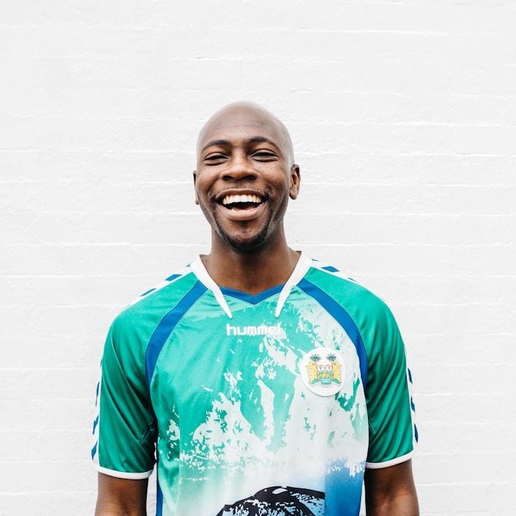 Kaveri Mehta, Lead Design Curator at GlassBeaconUrban, reviewing corporate floral arrangements